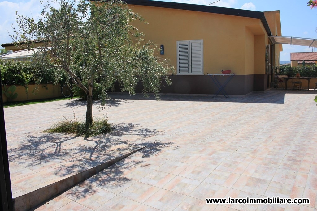 Four family house with large paved courtyard