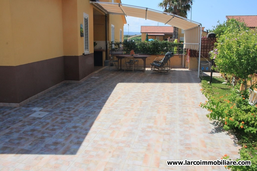 Four family house with large paved courtyard