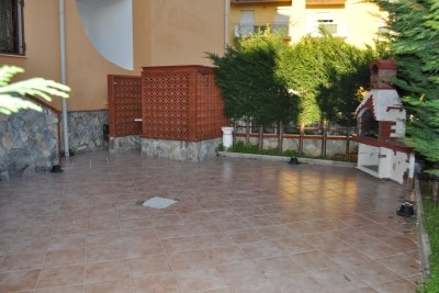 Two-level apartment with paved courtyard