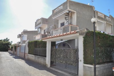 Four family house with large paved courtyard